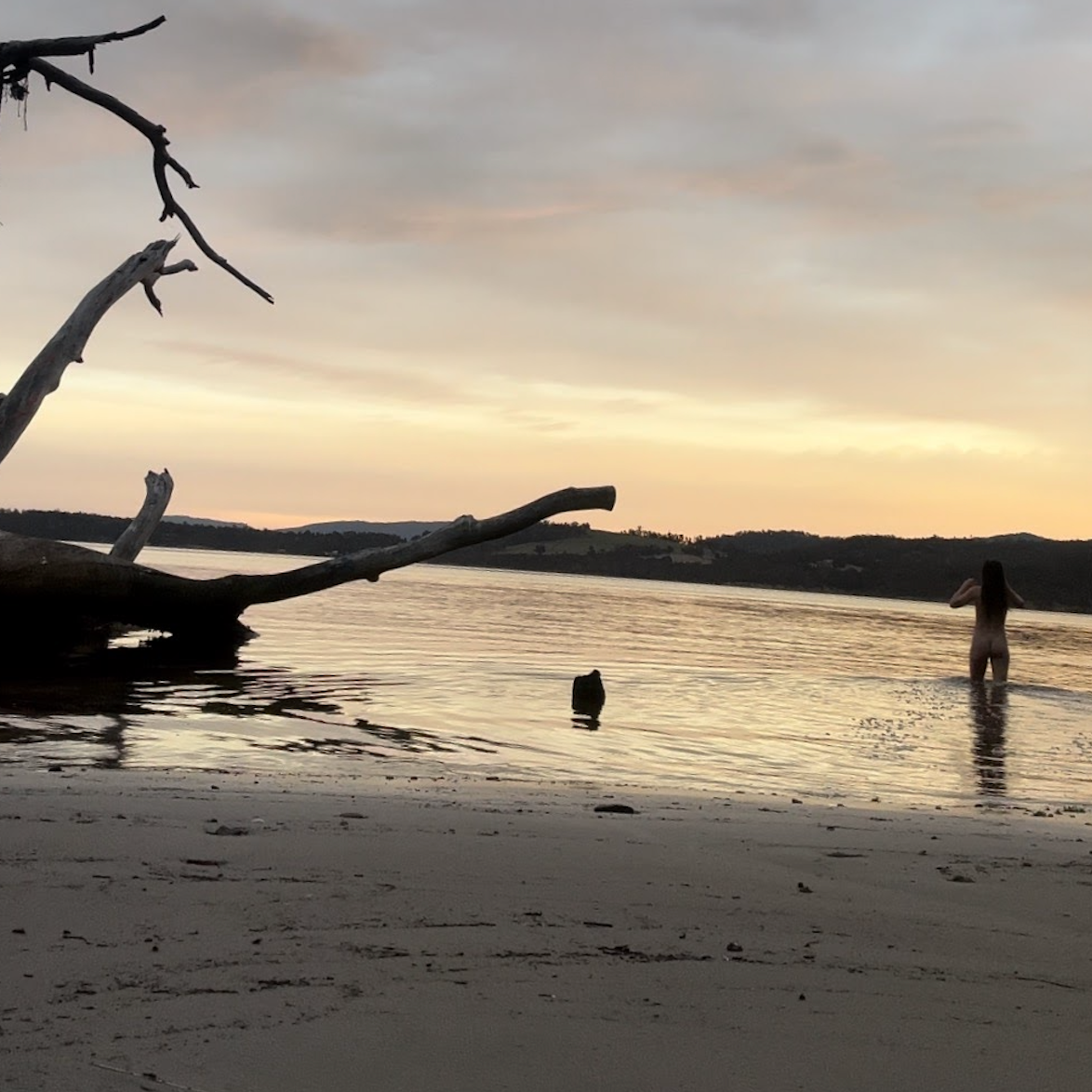 Woman walking into water