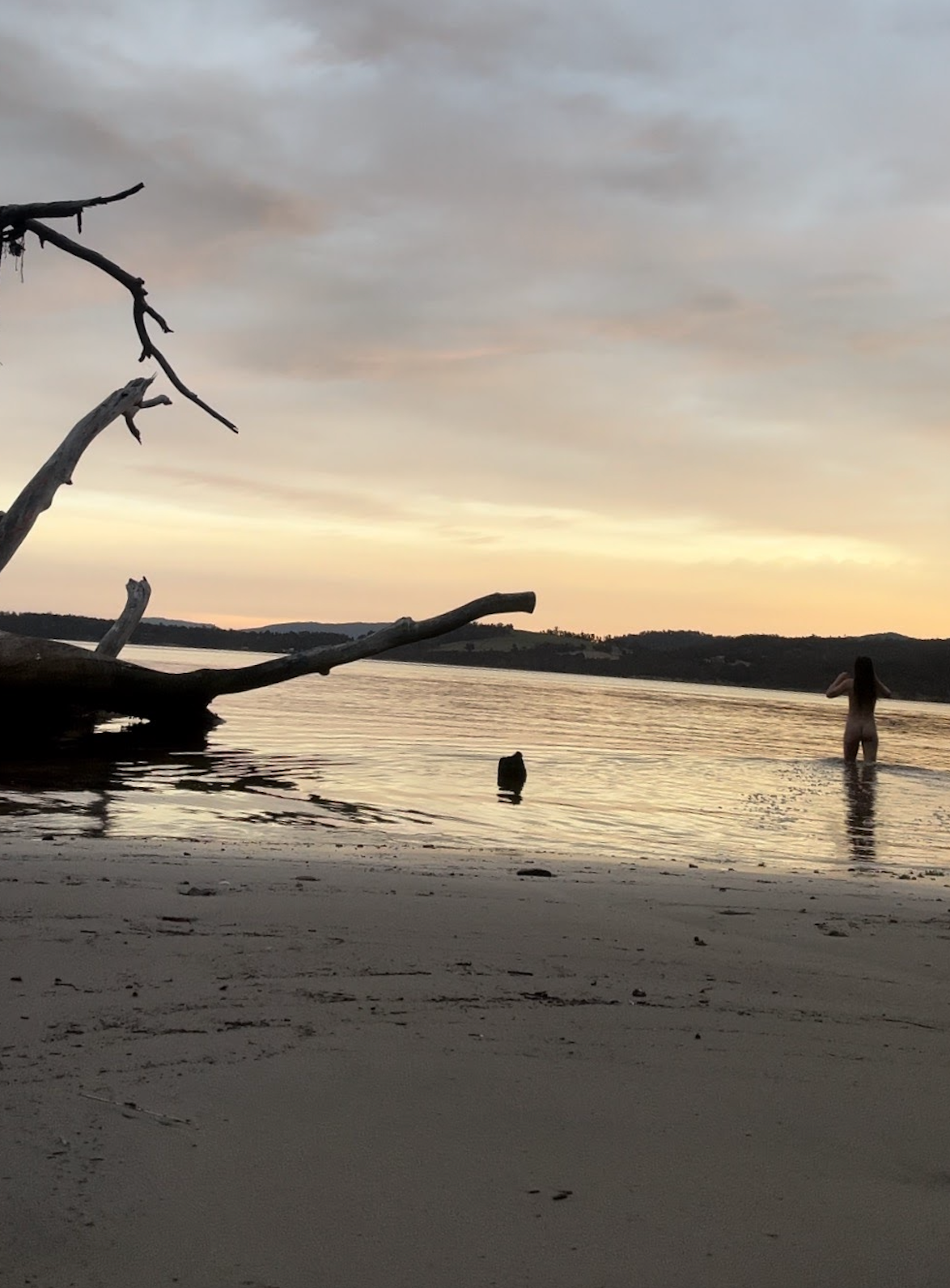Woman walking into water
